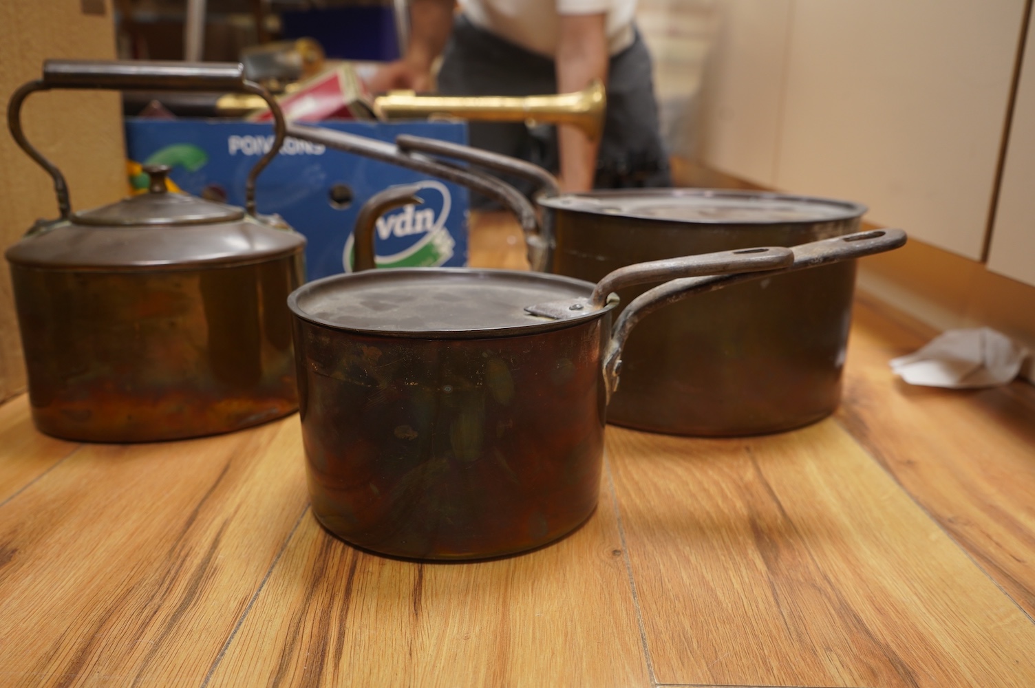 Two Benham & Froud copper saucepans and a copper kettle, largest 43cm in length